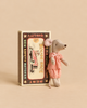 A Maileg Big Sister Mouse in Matchbox, a soft fabric mouse wearing a pink polka-dot dress, stands next to a vintage-style matchbox labeled “Mouse Race.”
