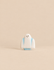 A small, handmade Bumbu Haunted Tree Halloween Set ghost figurine with blue accents on a plain beige background, perfect for small world play.