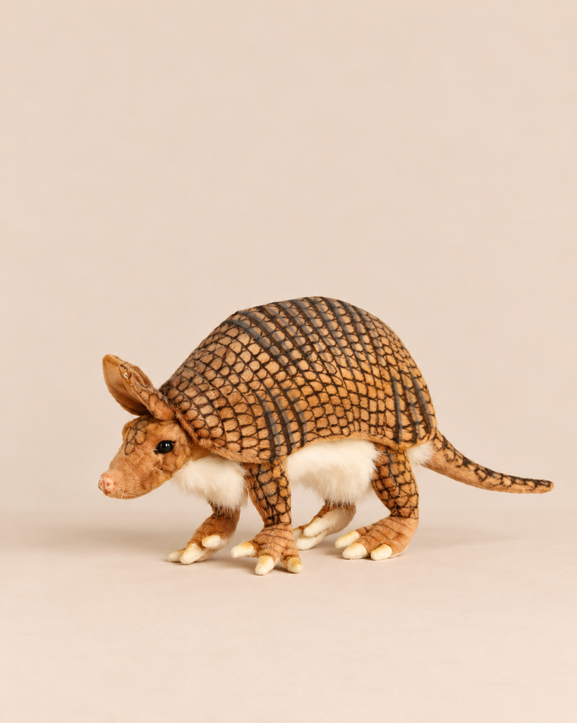Artisan crafted Armadillo Stuffed Animal plush with a patterned shell and white underbelly.