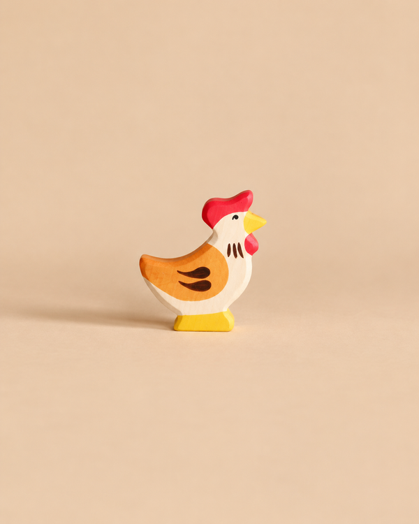 Holztiger Hen, Standing, a handcrafted wooden toy figurine with a red comb and yellow beak.
