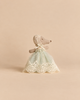 A Maileg Baby Mouse in Gown - Mint, a stuffed baby mouse wearing a lace bonnet and a mint green tulle celebration dress with lace trim.
