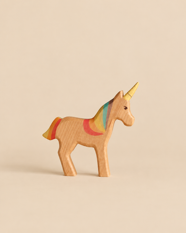 Handmade Holzwald Unicorn Rainbow wooden toy with a painted rainbow mane, tail, and horn.