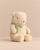 Maileg Teddy Bear Plush, Medium - Off White, sitting upright in a thin green scarf.