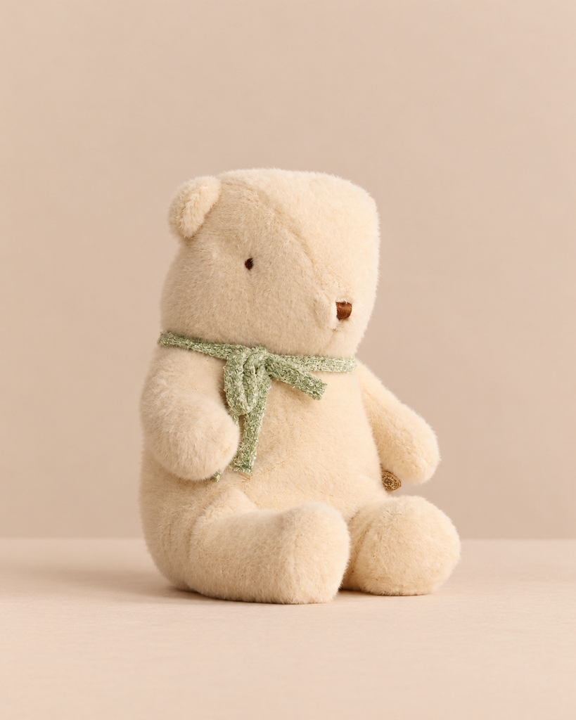 Maileg Teddy Bear Plush, Medium - Off White, sitting upright in a thin green scarf.