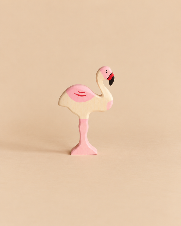 Holztiger Flamingo handcrafted wooden toy painted in shades of pink and black.