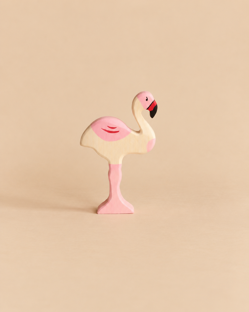 Holztiger Flamingo handcrafted wooden toy painted in shades of pink and black.