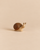 Bumbu Handmade Wooden Snail toy with a brown shell and carved spiral detail.