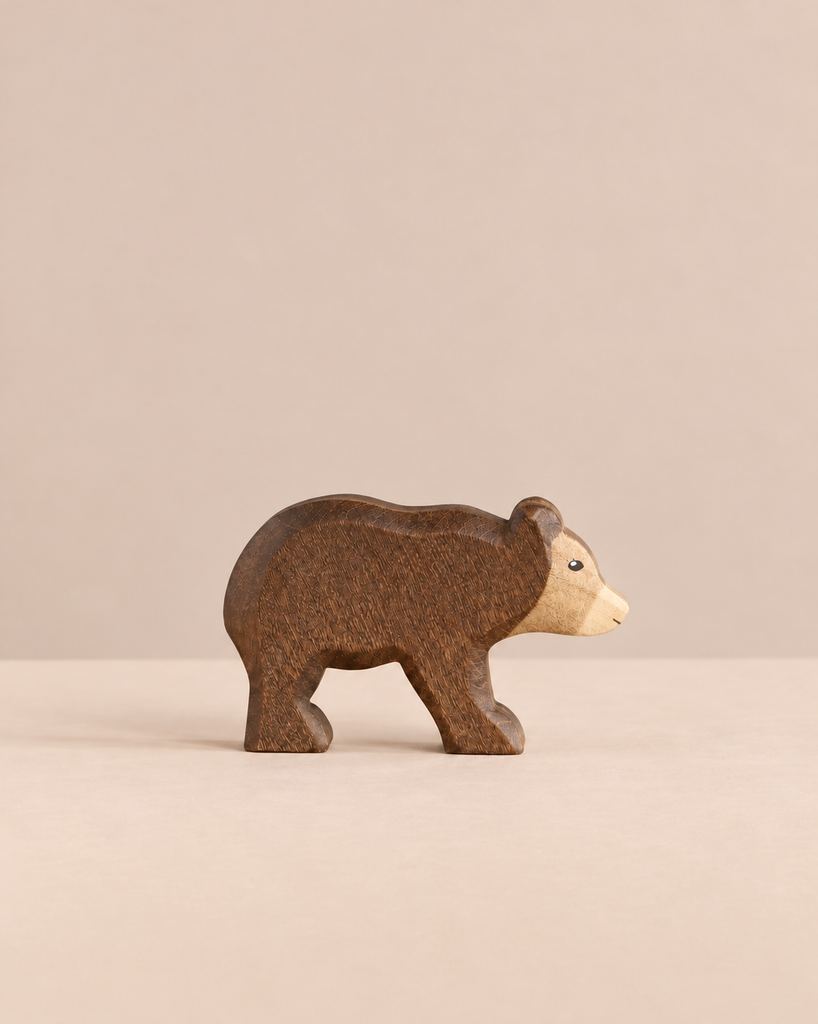 Handmade Holzwald Small Bear - Walking, a small wooden toy bear in a walking pose with a dark brown body and a light tan face, crafted as a sustainable toy.