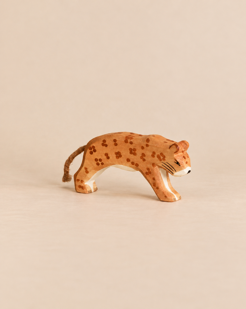Handcrafted Ostheimer Leopard wooden toy featuring a tactile rope tail, perfect for imaginative play.