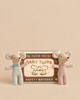 Two Maileg Twins, Baby Mice in Matchbox - Checker standing in front of a matchbox bed labeled “Baby Twins.”