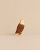 Handmade Holzwald Bird - Eagle: a small wooden figurine of a bald eagle in profile, crafted as an educational toy.