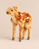 Newborn Deer Stuffed Animal with brown fur and white spots standing on all fours.
