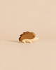 An Ostheimer Hedgehog handcrafted from wood, featuring brown painted quills and a light wood face, perfect for imaginative play.