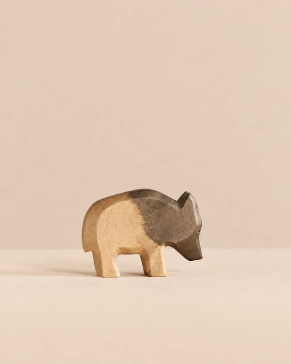 Handmade Holzwald Wild Boar - Mother, a hand-carved wooden figurine with a dark brown head and light wood body.