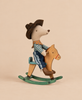 A Maileg Cowboy Mouse on Rocking Horse, Little Brother plush sitting on a small wooden rocking horse.