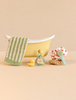 Maileg Bathtub Set, Mouse - Yellow includes a miniature bathtub, green-striped towel, rubber duck, shampoo bottle, polka-dot shower cap, and brush.