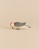 Handcrafted Ostheimer Woodpecker toy with a red crest, grey body, and light underside, perfect for imaginative play.