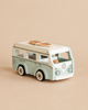 Pale blue and white vintage Camper Van toy with a surfboard on its roof.