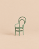 A miniature sage green Maileg Garden Tea Set chair with a looped backrest.