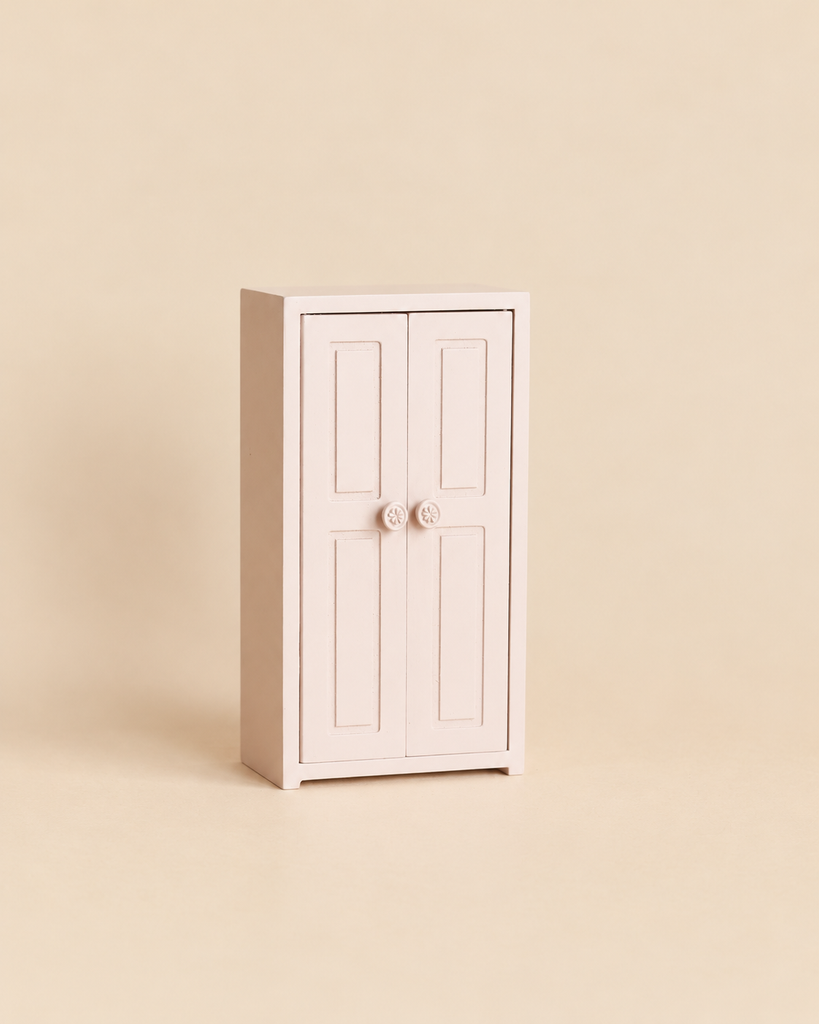 Maileg Mouse Closet - Light Rose, a light pink miniature closet with two doors and small round knobs, perfect for dollhouse furniture.