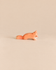 An Ostheimer Small Fox - Creeping, a small, handcrafted wooden fox figurine in a crouching position, perfect for imaginative play.