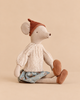 Maileg Mouse, Medium - Skirt and Sweater wearing a brown knit cap, a cream ribbed sweater, a blue flower printed skirt, and brown slippers.