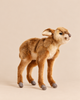 A realistic Baby Antelope Stuffed Animal standing in profile, crafted in the style of HANSA animals.