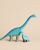 Bumbu Handmade Wooden Brontosaurus Dinosaur Set featuring two handcrafted wooden figures, one large and one small, both blue and decorated with purple spots.