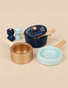 Pots & Pans Kitchen Accessories set featuring a navy blue pot with a lid, a gold pan, a light blue pan, and salt and pepper shakers for pretend play.