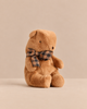 Small Maileg Teddy Bear Plush, Mushroom, in brown, wearing a brown and black plaid bow tie.