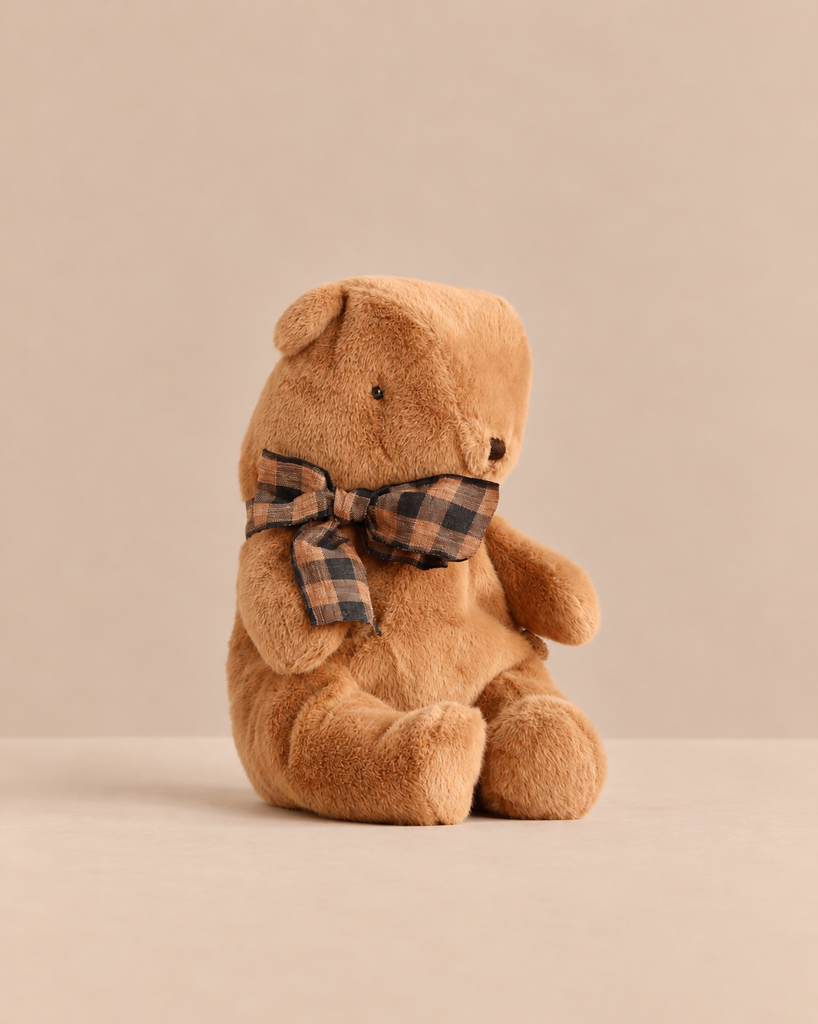 Small Maileg Teddy Bear Plush, Mushroom, in brown, wearing a brown and black plaid bow tie.
