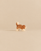 Handcrafted Ostheimer Dog - Saint Bernhard, Small - Head Down wooden figurine of a brown and white dog with its head bowed.