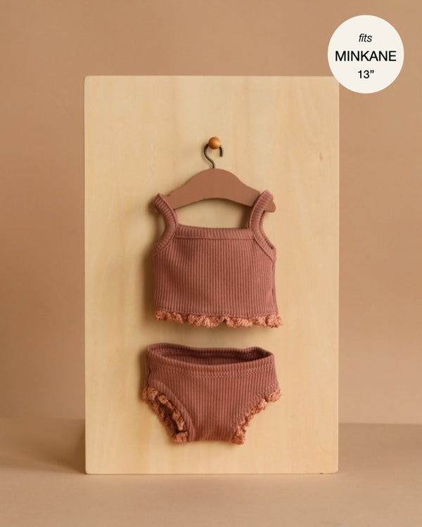 Minikane 13" Doll Clothing | Les P'tits Basiques 2-Piece Set in ribbed clay pink cotton for Minikane Gordis dolls. Includes a ruffled tank and matching bottoms, shown on a wooden hanger. Made in France—fits MINKANE 13".