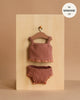 Minikane 13" Doll Clothing | Les P'tits Basiques 2-Piece Set in ribbed clay pink cotton for Minikane Gordis dolls. Includes a ruffled tank and matching bottoms, shown on a wooden hanger. Made in France—fits MINKANE 13".