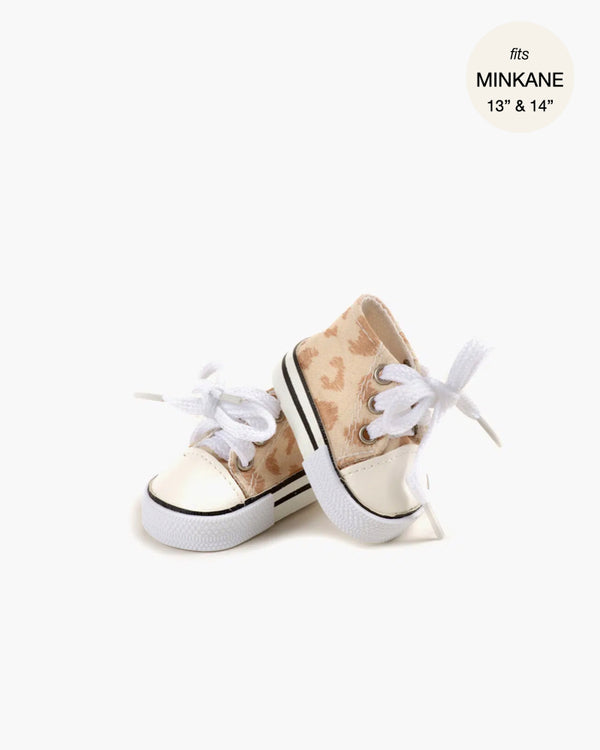 A pair of Minikane Doll Shoes | Converse Style Feline Print Sneakers in beige and white with heart patterns, white laces, and rubber soles are displayed side by side, slightly overlapping, on a plain white background.