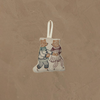 The Coral & Tusk Ice Skater Bears Ornament features two embroidered bears—one in blue pants and shirt, the other in a red skirt and top—holding hands as they skate. A white loop makes it easy to hang. Perfect as an adorable anniversary gift.