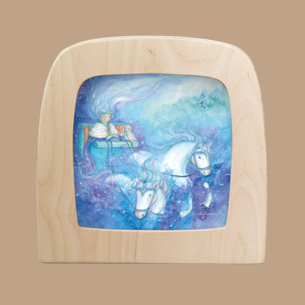 The "Silhouette Only - Ice Queen Silhouette for Toverlux Lamp" features a graceful silhouette of an Ice Queen in a chariot with two white horses, set amid swirling blue and purple mist.