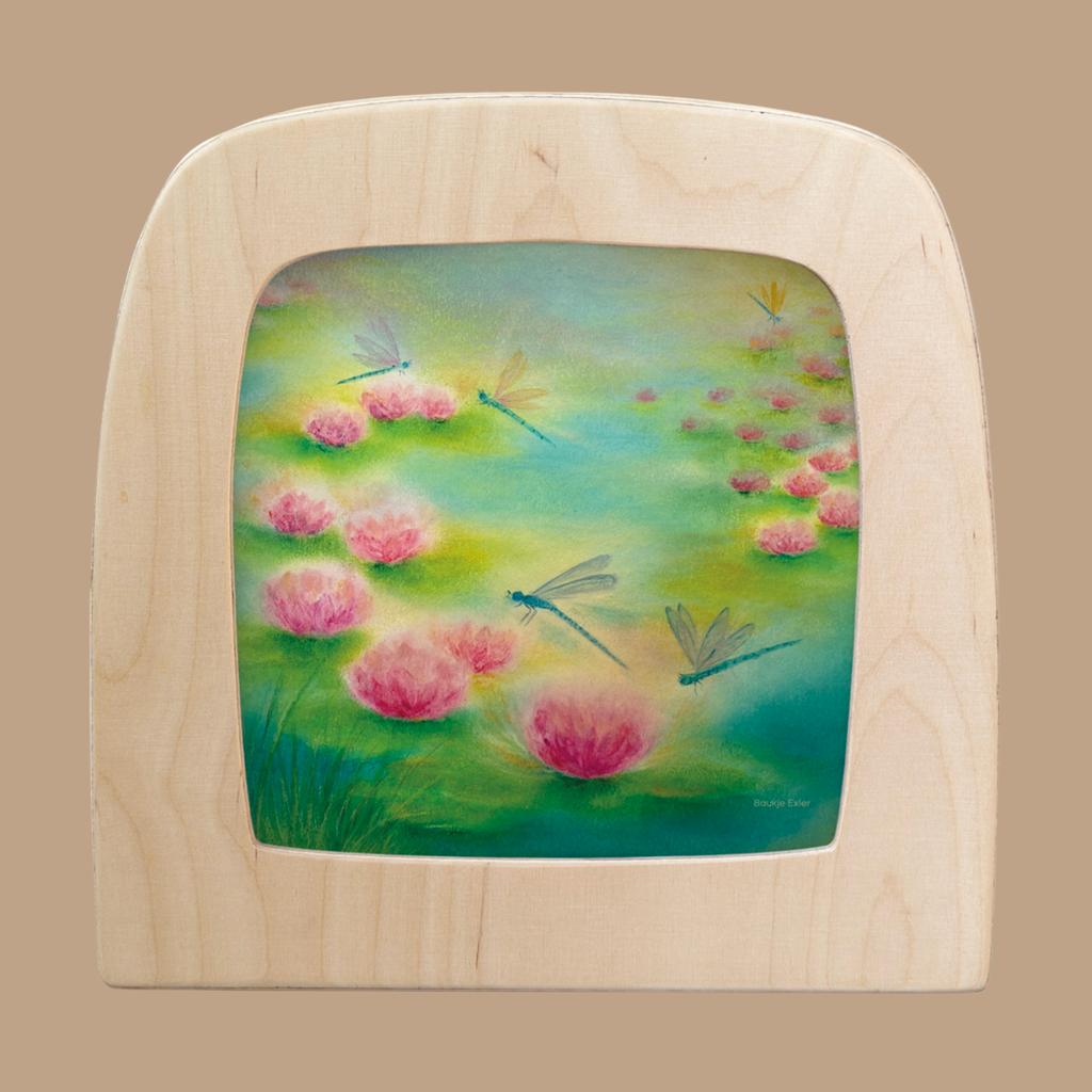 A "Silhouette Only - Dragonfly Silhouette for Toverlux Lamp" shows blue and yellow dragonflies above pink water lilies in a green pond, creating a soft, dreamy scene when displayed in a wooden Toverlux frame.