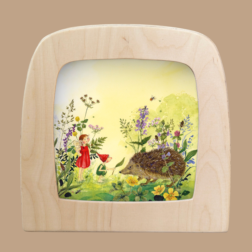 The Silhouette Only - Hedgehog for Toverlux Lamp features a charming scene of a girl in a red dress with a hedgehog among wildflowers under a yellow sky—an enchanting touch to brighten your home decor.