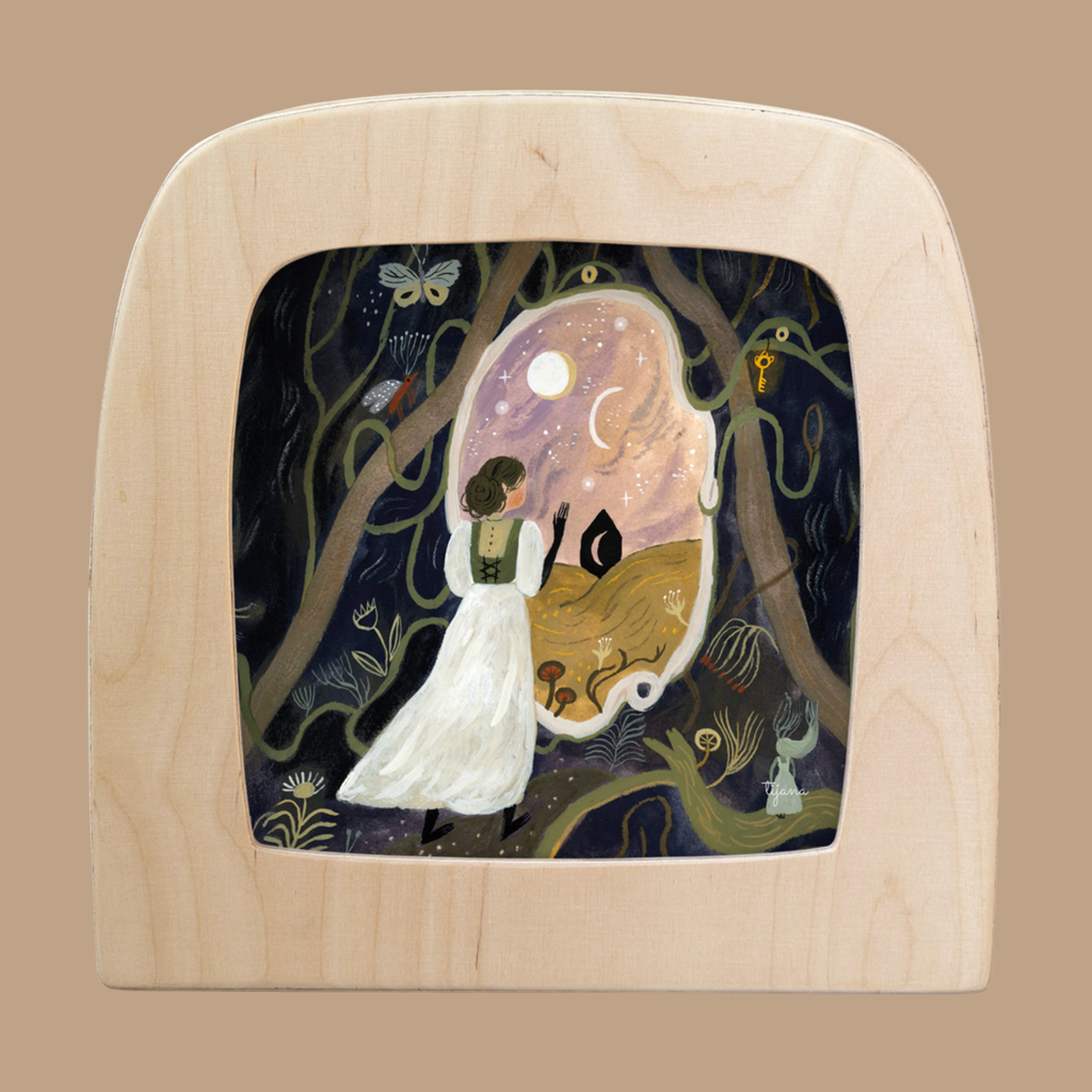 A woman in a white dress stands in a magical forest, gazing through a portal at a cat under the moon and stars. Surrounded by mysterious keys and plants, this scene features the Silhouette Only - Portals for Toverlux Lamp framed by light wood.