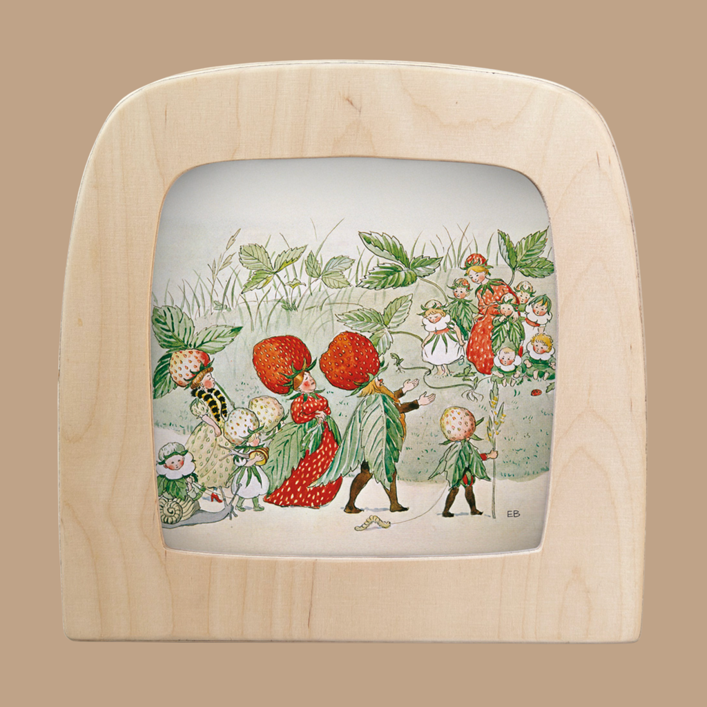 This light wood-framed illustration features whimsical, leaf-clad characters with strawberry heads parading through the grass, inspired by Christopher's Garden Magic and depicted in the "Silhouette Only - Family Strawberry for Toverlux Lamp" design.