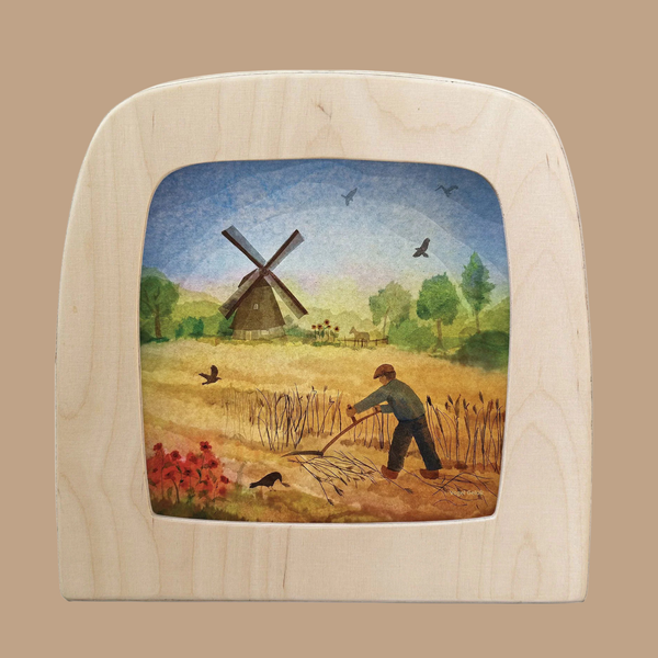 A Magic Silhouettes "Windmill" illustration for the Toverlux Lamp features a farmer with a rake in a field, birds flying, trees, flowers, and a windmill under a blue sky.