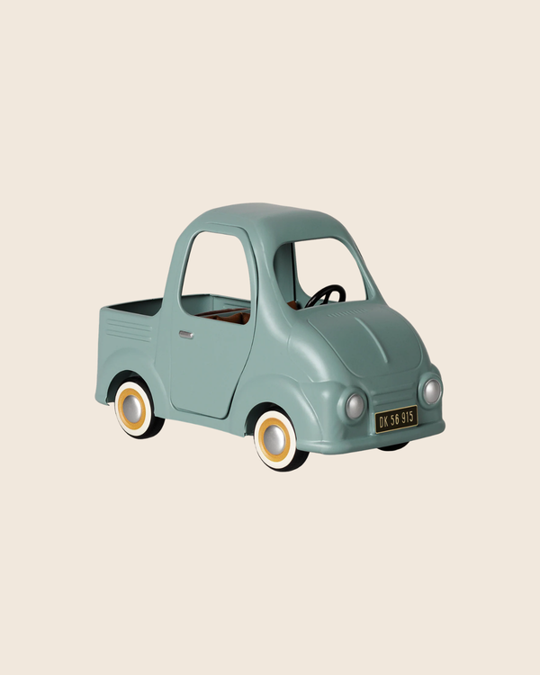 The PRE-ORDER: Maileg Truck, Mouse (Estimated Arrival Early November) is a small vintage-style pastel green toy pickup with whitewall tires and a black license plate, perfect for play scenes or as a charming mouse family car.