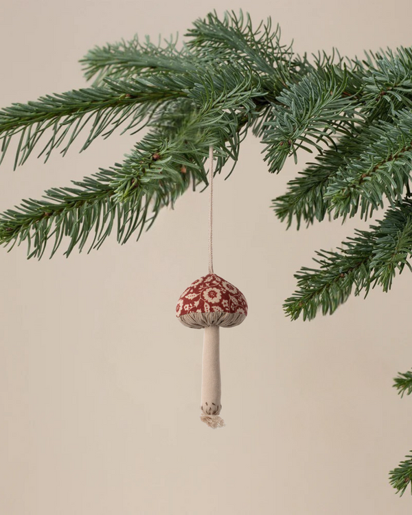 The Maileg Christmas Fabric Ornament, Mushroom - Winter Flower - Red, features an embroidered red and white mushroom, perfect for bringing festive charm to your tree.