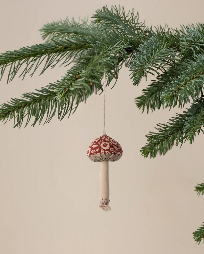 The Maileg Christmas Fabric Ornament, Mushroom - Winter Flower - Red, features an embroidered red and white mushroom, perfect for bringing festive charm to your tree.