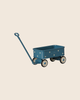 The PRE-ORDER: Maileg Wagon, Mouse - Blue is a small metal toy wagon with white polka dots, four wheels, and a long handle. Shown on a beige background, it’s perfect for mouse family accessories. Estimated arrival: Mid September.