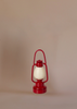 A Maileg Grandma And Grandpa Afternoon Tea set is placed upright against a plain beige background, creating a cozy scene reminiscent of a Maileg Mice display.