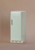 A small, light green vintage-style Maileg Little Chef's Kitchen Set refrigerator, labeled "MAILEG" on the front, is perfect for your Miniature Kitchen and stands against a plain beige background.