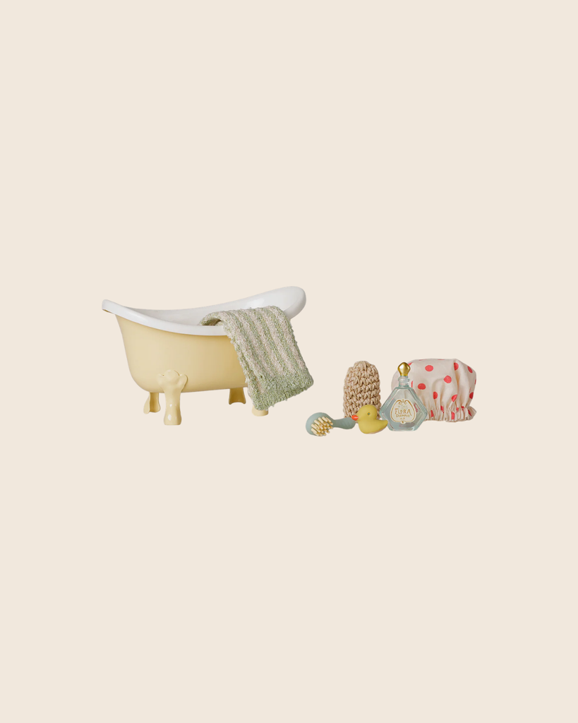 The PRE-ORDER: Maileg Bathtub Set, Mouse - Yellow includes a miniature yellow clawfoot tub with towel, sponge, scrubbing brush, rubber duck, bath bottle, and polka-dot shower cap—a charming pretend play bath set for kids. Estimated arrival mid October.