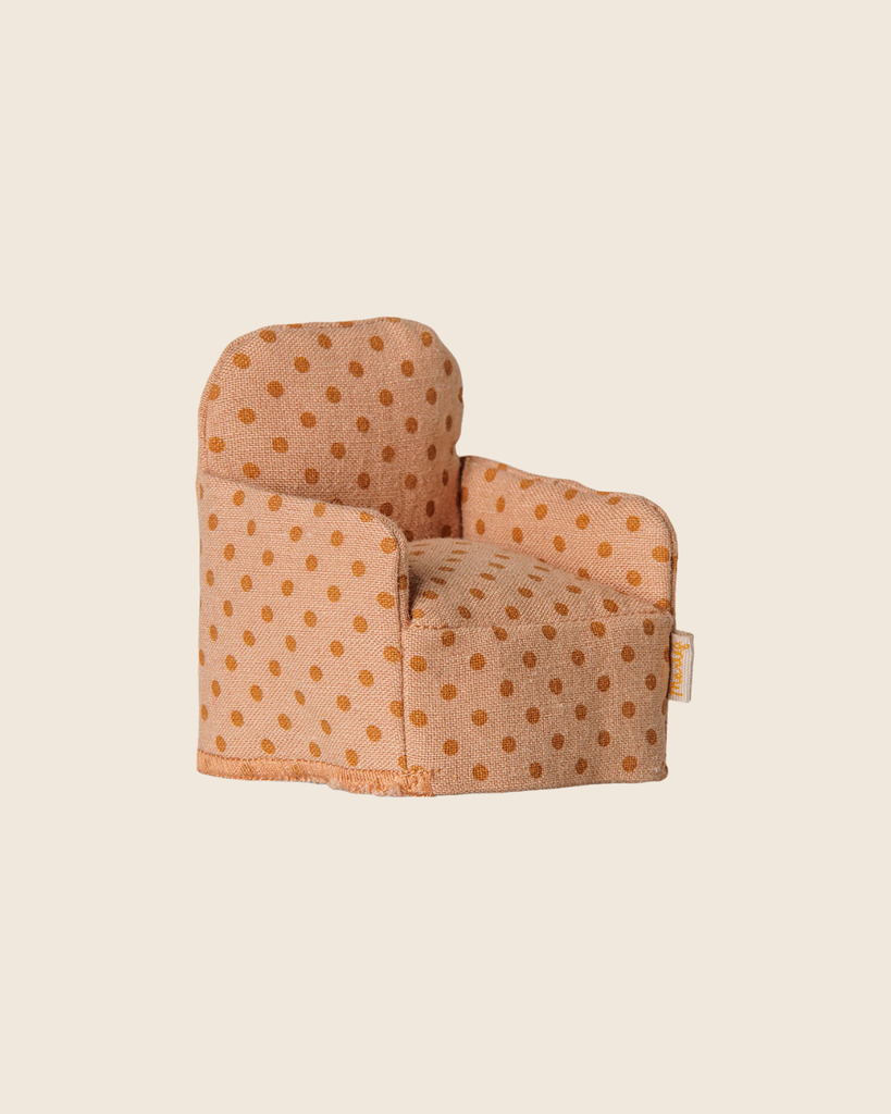 The PRE-ORDER: Maileg Folding Chair, Mouse - Dots (Estimated Arrival Mid September) features a charming orange polka-dot design—ideal for dollhouse furniture or adding a cozy touch to your Mouse hole Farmhouse.